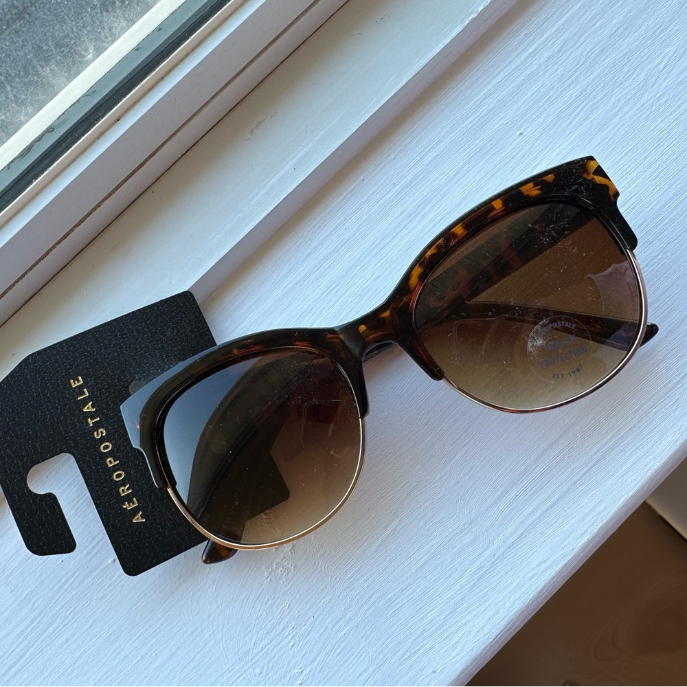 Tortoise shell half rimmed sunglasses